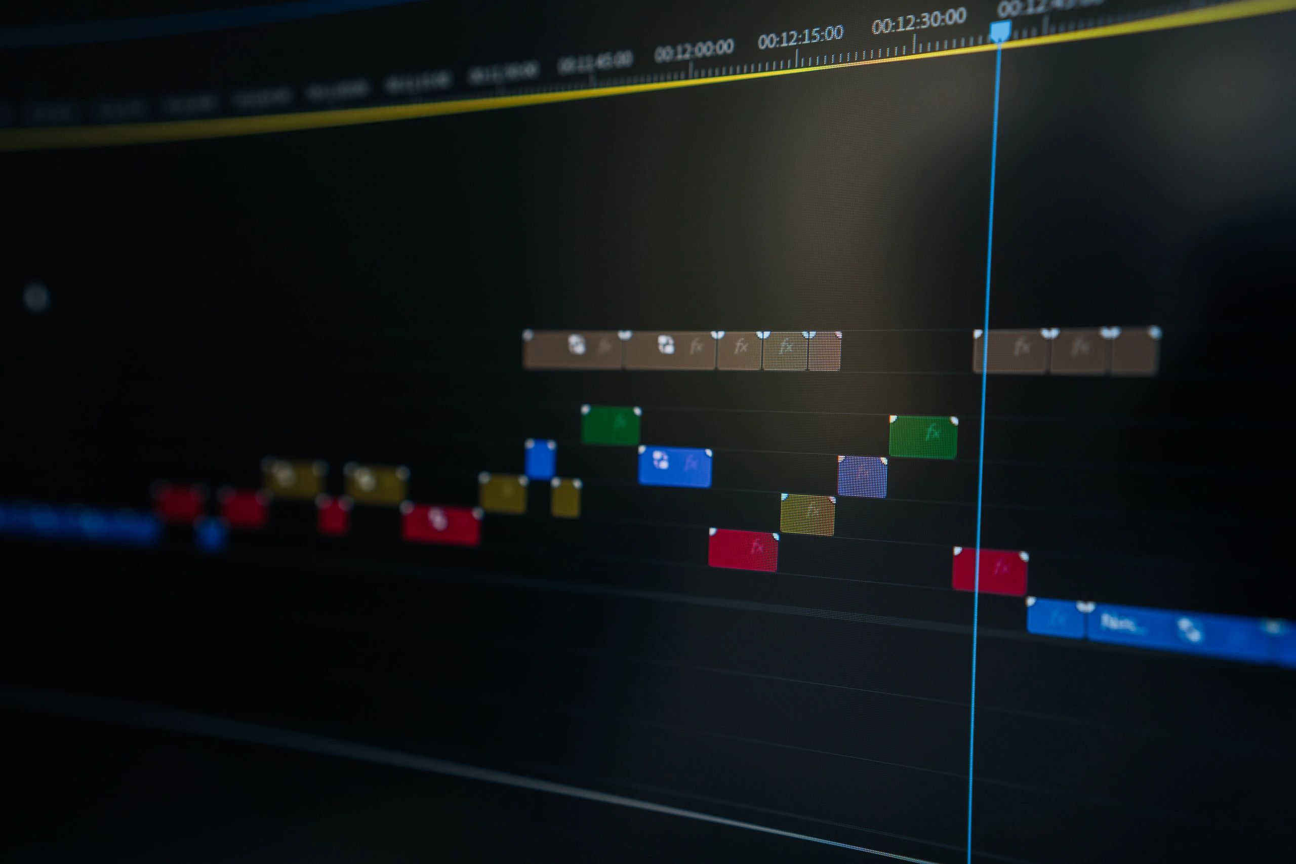 Close-up of a video editing timeline with clips and audio tracks